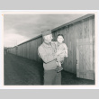 Serviceperson holding baby (ddr-densho-1007-210)