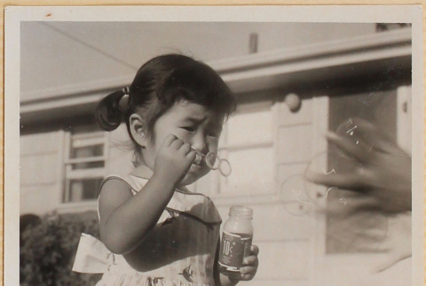 Leslie Shiomi with bubbles (ddr-densho-522-546)