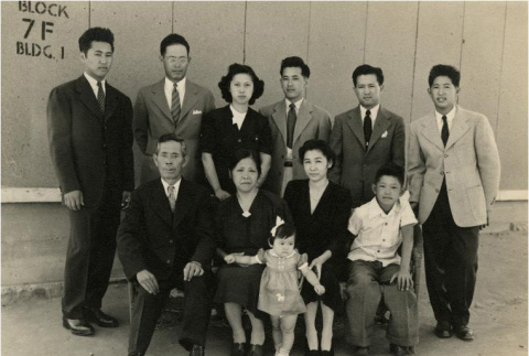 Family in front of barracks (ddr-densho-159-302)