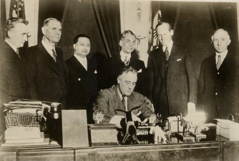 Franklin D. Roosevelt signing a Document at his desk (ddr-njpa-1-1506)