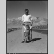 Man walking with grandson (ddr-densho-151-374)