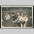 Group photo of six men sitting in a field (ddr-densho-483-201)