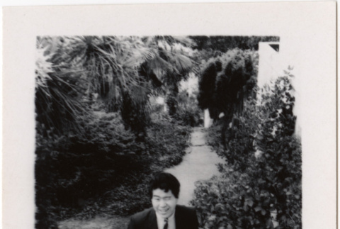 Norman Takahashi on stairs (ddr-densho-426-218)