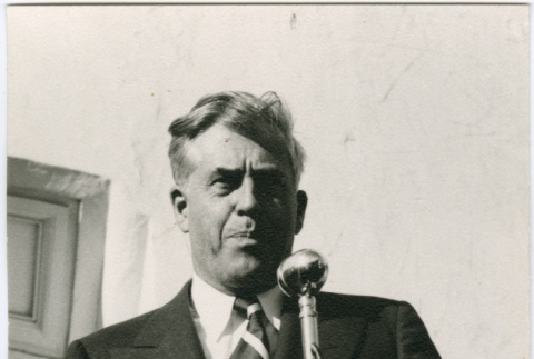 Man speaking at microphone (ddr-densho-426-983)