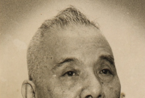 Takejiro Otani wearing leis (ddr-njpa-4-1920)