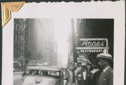 Men standing on sidewalk outside Anne's Restaurant (ddr-densho-434-146)