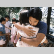 Charles Yuki giving a hug during communion on the last day of camp (ddr-densho-336-1808)
