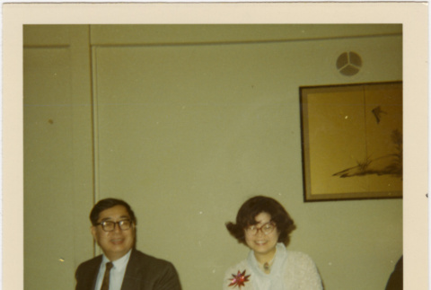 Tomoye and Henri Takahashi seated at a table (ddr-densho-426-167)