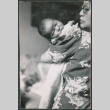 Woman holding a baby (ddr-densho-523-53)