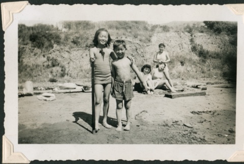 Two children pose at the beach (ddr-densho-321-224)
