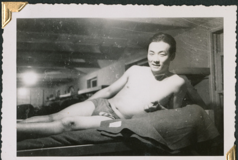 Man laying bunk (ddr-densho-434-279)