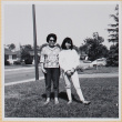 Woman and girl standing in yard (ddr-densho-522-107)