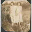 Two young women standing in field (ddr-densho-316-179)