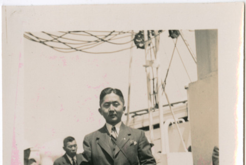 Man standing on deck of ship (ddr-densho-426-1990)