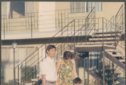 Couple with boy standing by stairs (ddr-densho-523-430)
