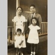 Couple posing with son and daughter (ddr-njpa-2-365)