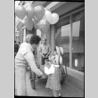 Balloon seller with two small girls (ddr-densho-426-2306)