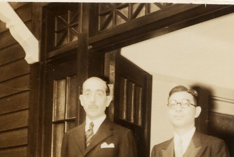 Two men standing in a doorway (ddr-njpa-1-2498)