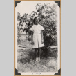 Girl standing by a bush (ddr-densho-542-181)