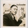 Man eating sushi (ddr-densho-426-2119)
