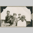 Four young men aboard ship (ddr-densho-383-58)
