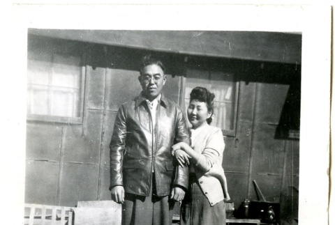 Man and woman standing in front of barracks (ddr-manz-6-75)