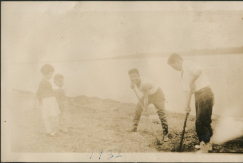 Digging on a beach (ddr-densho-321-675)