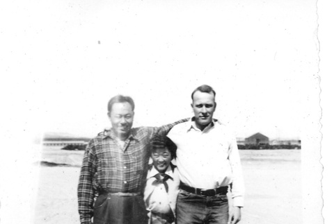 Japanese American man and girl with a camp administrator (ddr-densho-157-20)