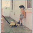Boy in cowboy hat with truck (ddr-densho-523-548)