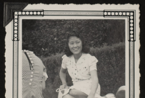 Sadako seated in the grass (ddr-densho-542-372)