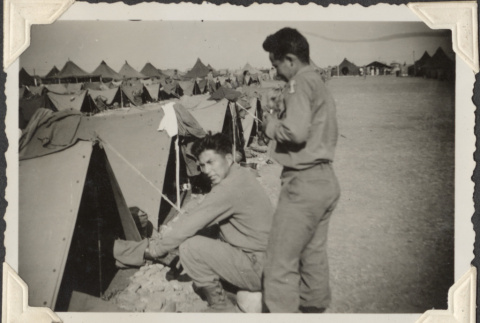 Two men outside rows of tents (ddr-densho-466-755)