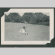 A girl playing in a field (ddr-densho-321-932)