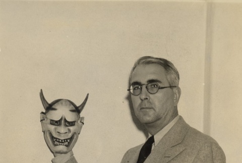 Gregg M. Sinclair holding Noh mask (ddr-njpa-2-1158)