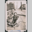 Toddler in wagon on sidewalk (ddr-densho-483-652)