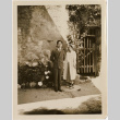 Tomoye (Nozawa) Takahashi and unknown man by stone wall (ddr-densho-426-1784)