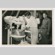Man using industrial mixer (ddr-densho-499-48)