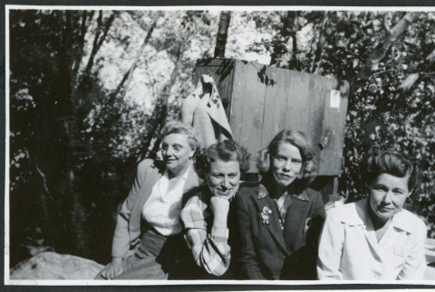 Photograph of Edna Anderson, L. Josephine Hawes, Eleanor Thomas and Elizabeth Moxley at a Manzanar hospital staff picnic (ddr-csujad-47-288)