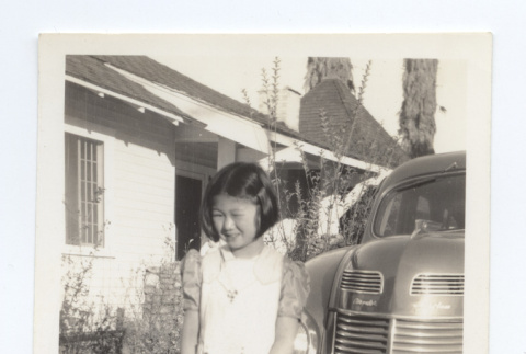 Girl wearing a dress and pinafore (ddr-one-6-1)