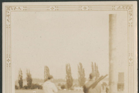 Men in baseball uniforms on field (ddr-densho-316-214)