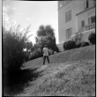 Two men on lawn of house on 36th and Shoreview (ddr-densho-426-909)