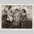 Three women standing by shelves (ddr-densho-426-377)