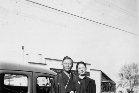 Couple standing next to car (ddr-ajah-6-188)