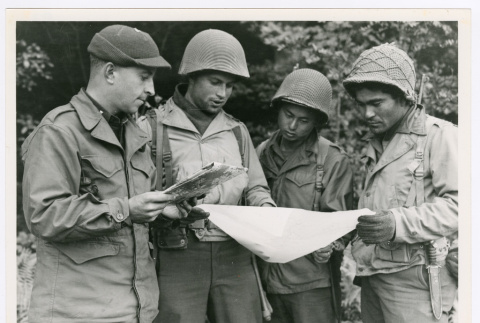Members of 442nd studying map of bivouac area in France (ddr-densho-1007-204)