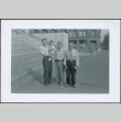 Three men and a baby near stairway (ddr-densho-293-184)