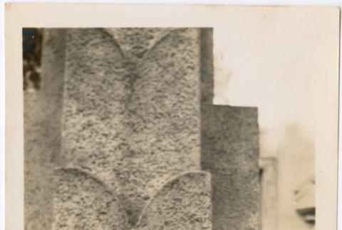 Tomoye (Nozawa) Takakashi standing by stone pillar (ddr-densho-423-469)