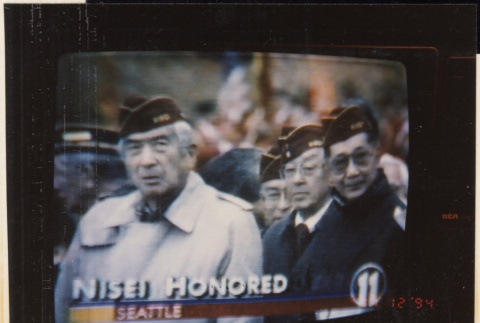 Photo of TV screen of Veterans Day event (ddr-densho-466-542)