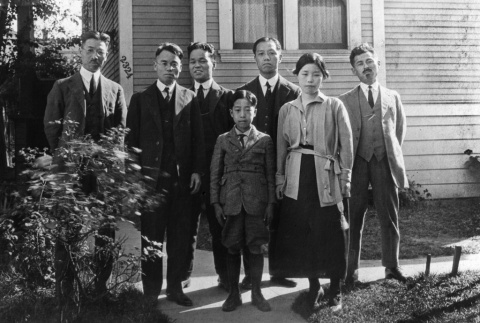 Takuritsu Morita and friends standing outside Morita's house (ddr-ajah-6-637)