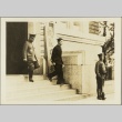 A Kempeitai[?] commander and a young man walking past a guard (ddr-njpa-13-1205)