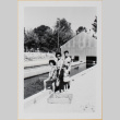 Yoshiko, William, Leslie and Susan Shiomi by waterway (ddr-densho-522-586)