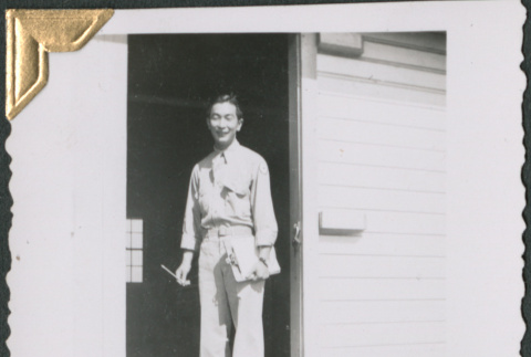 Man with clipboard on loading dock (ddr-densho-434-237)